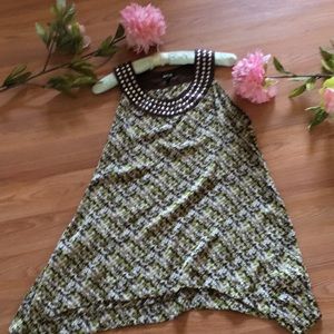 Medium beautiful sleeveless asymmetrical blouse.